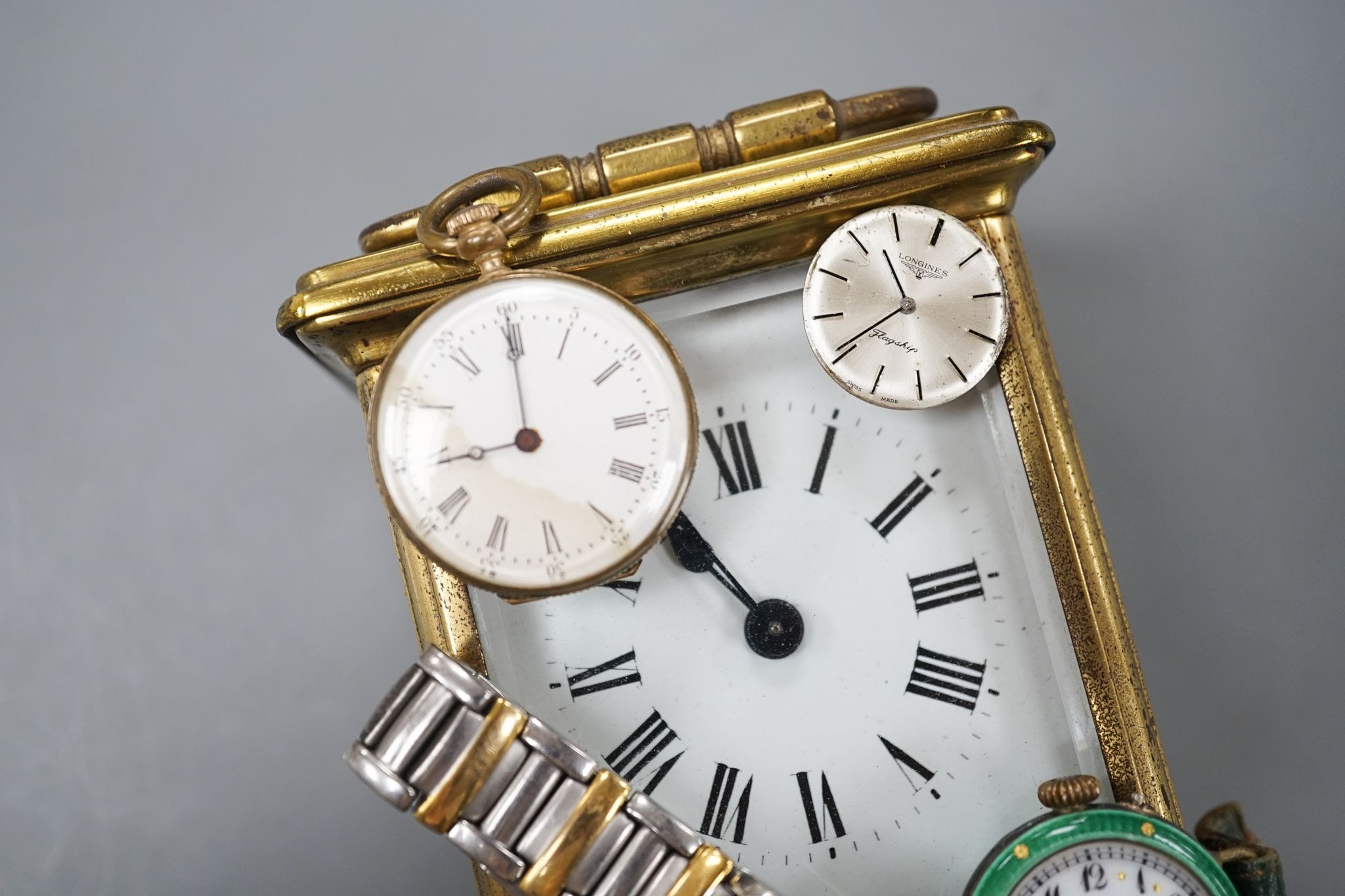 A Maurice Lacroix wrist watch, a carriage timepiece and three other watches including enamel(a.f.).